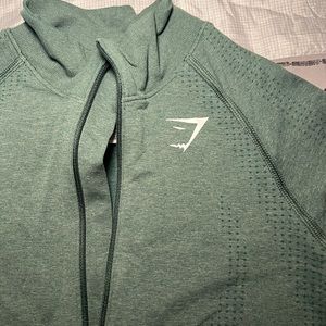 Gymshark green, quarter zip, long sleeve.